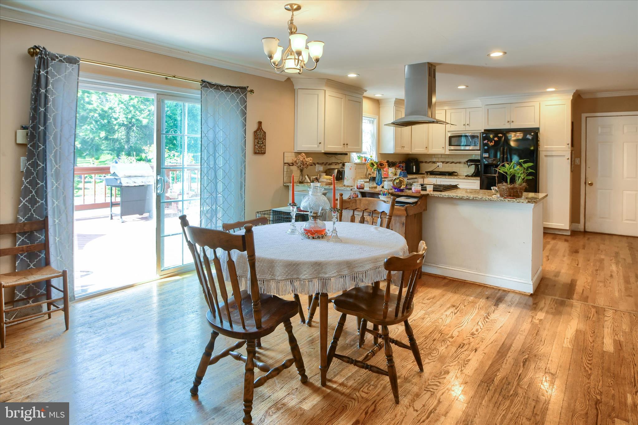 1010 Sweetbriar Road Perkasie, PA 18944 - Photo 17 of 59 a view of a dining room with furniture window and wooden floor