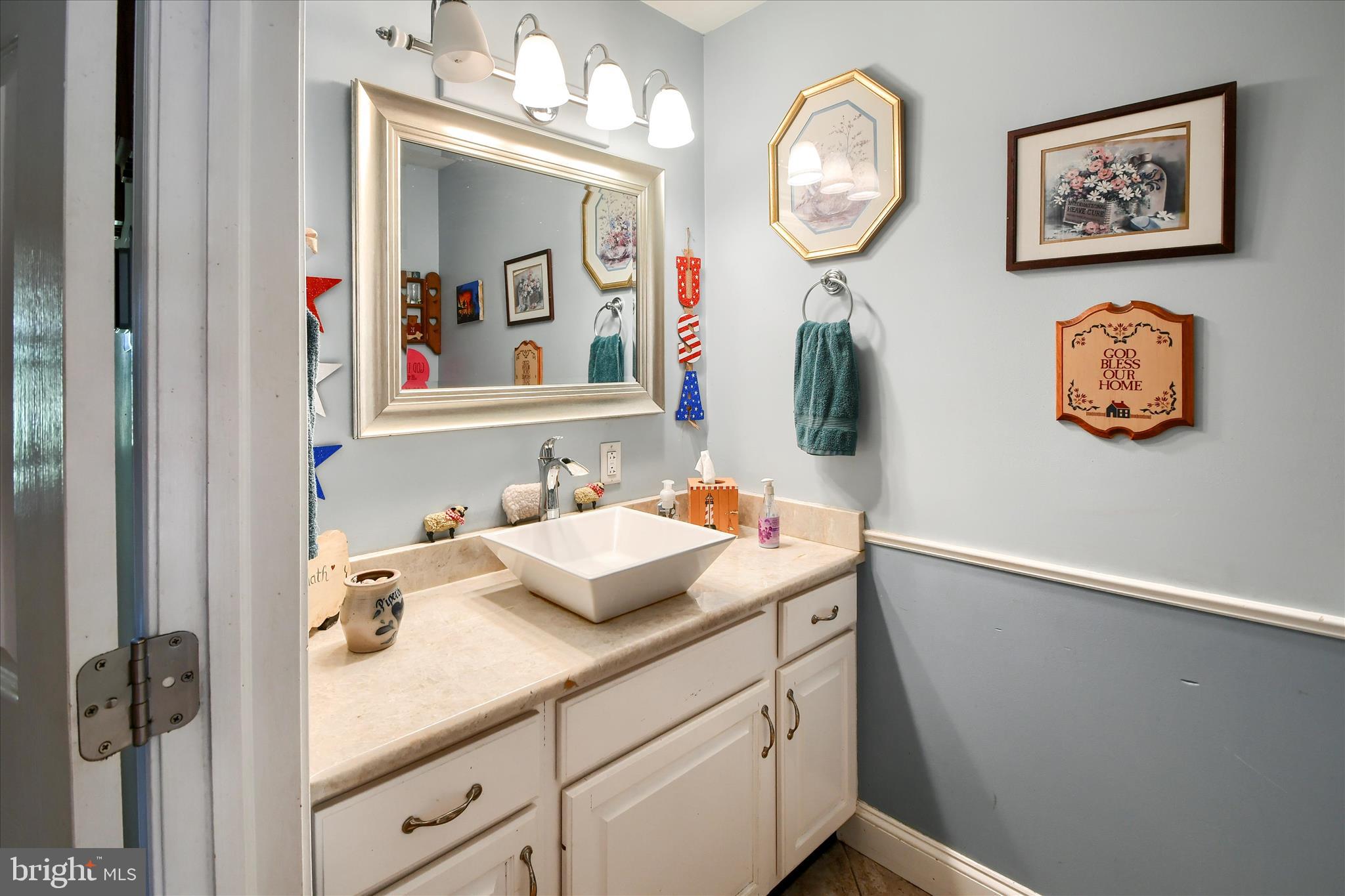 1010 Sweetbriar Road Perkasie, PA 18944 - Photo 20 of 59 a bathroom with a sink and a mirror