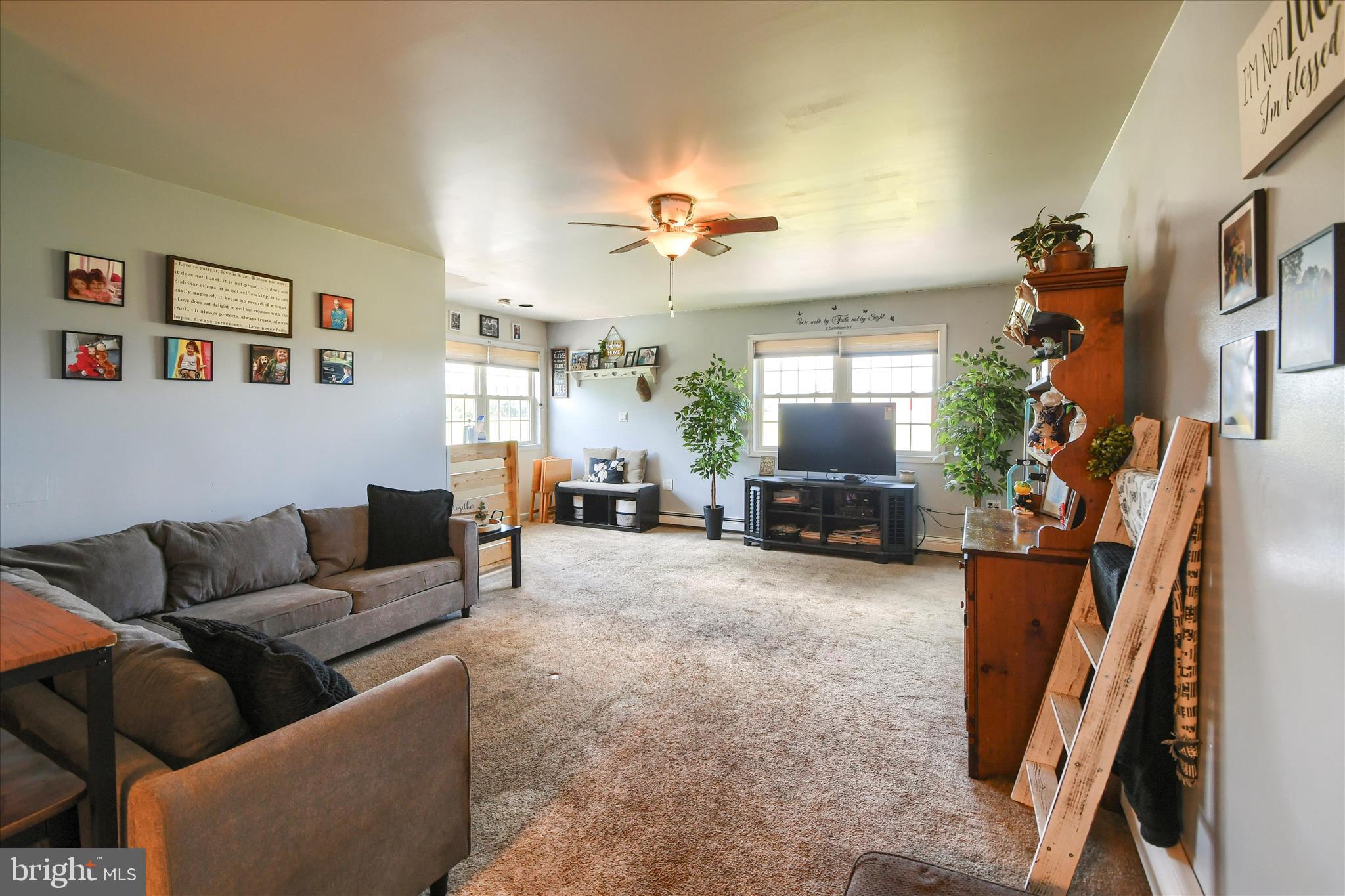 1010 Sweetbriar Road Perkasie, PA 18944 - Photo 27 of 59 a living room with furniture and a flat screen tv