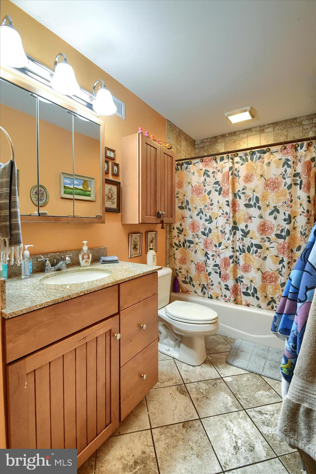1010 Sweetbriar Road Perkasie, PA 18944 - Photo 35 of 59 a bathroom with a granite countertop toilet sink and mirror