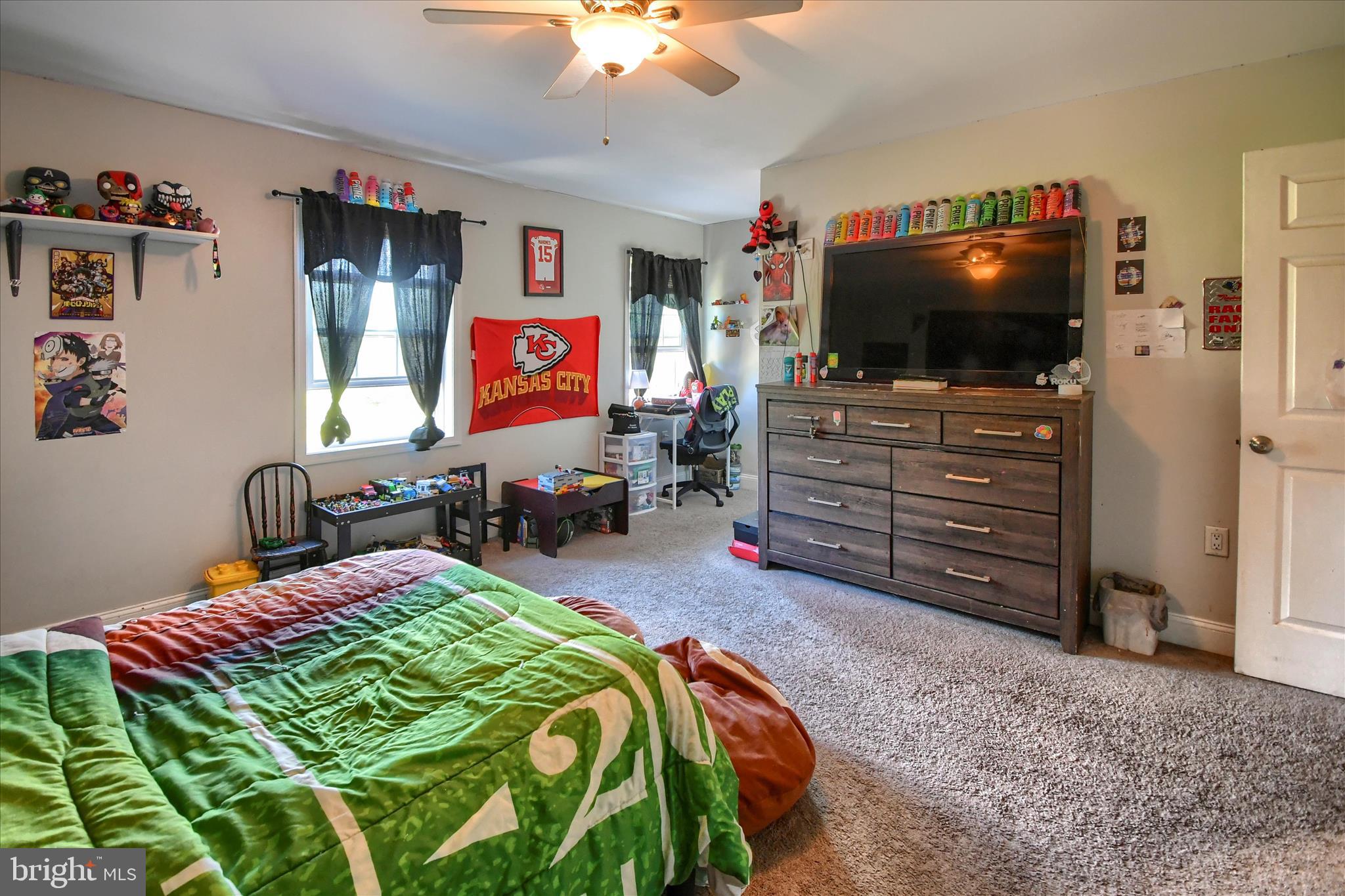 1010 Sweetbriar Road Perkasie, PA 18944 - Photo 39 of 59 a bedroom with a bed and flat screen tv