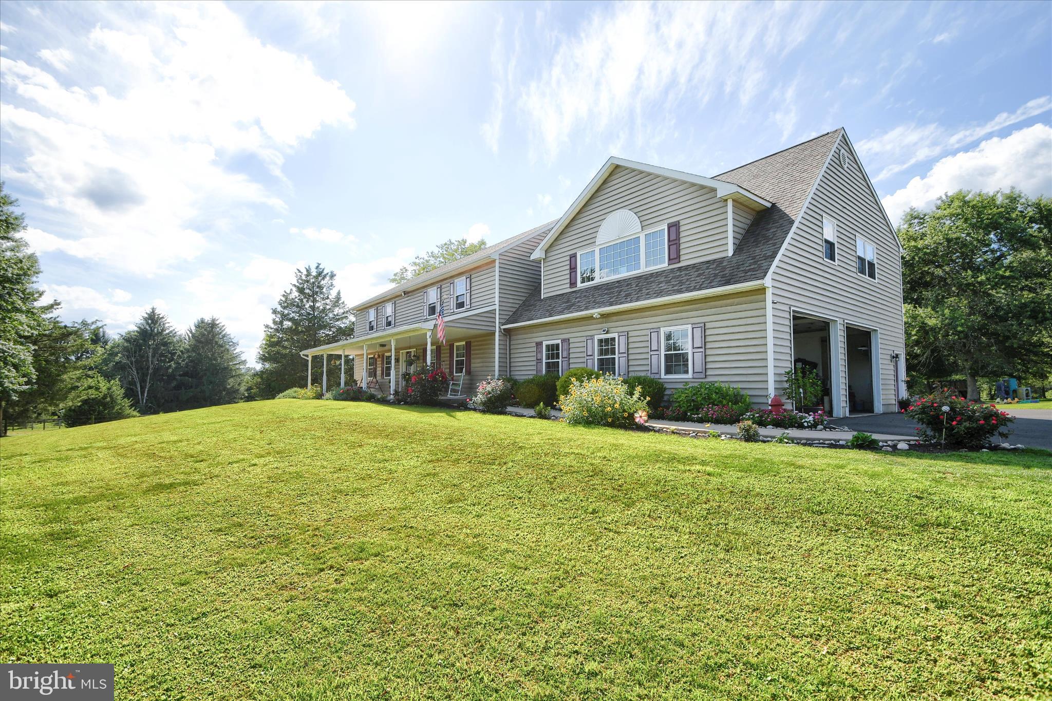 1010 Sweetbriar Road Perkasie, PA 18944 - Photo 4 of 59 a front view of a house with garden and porch