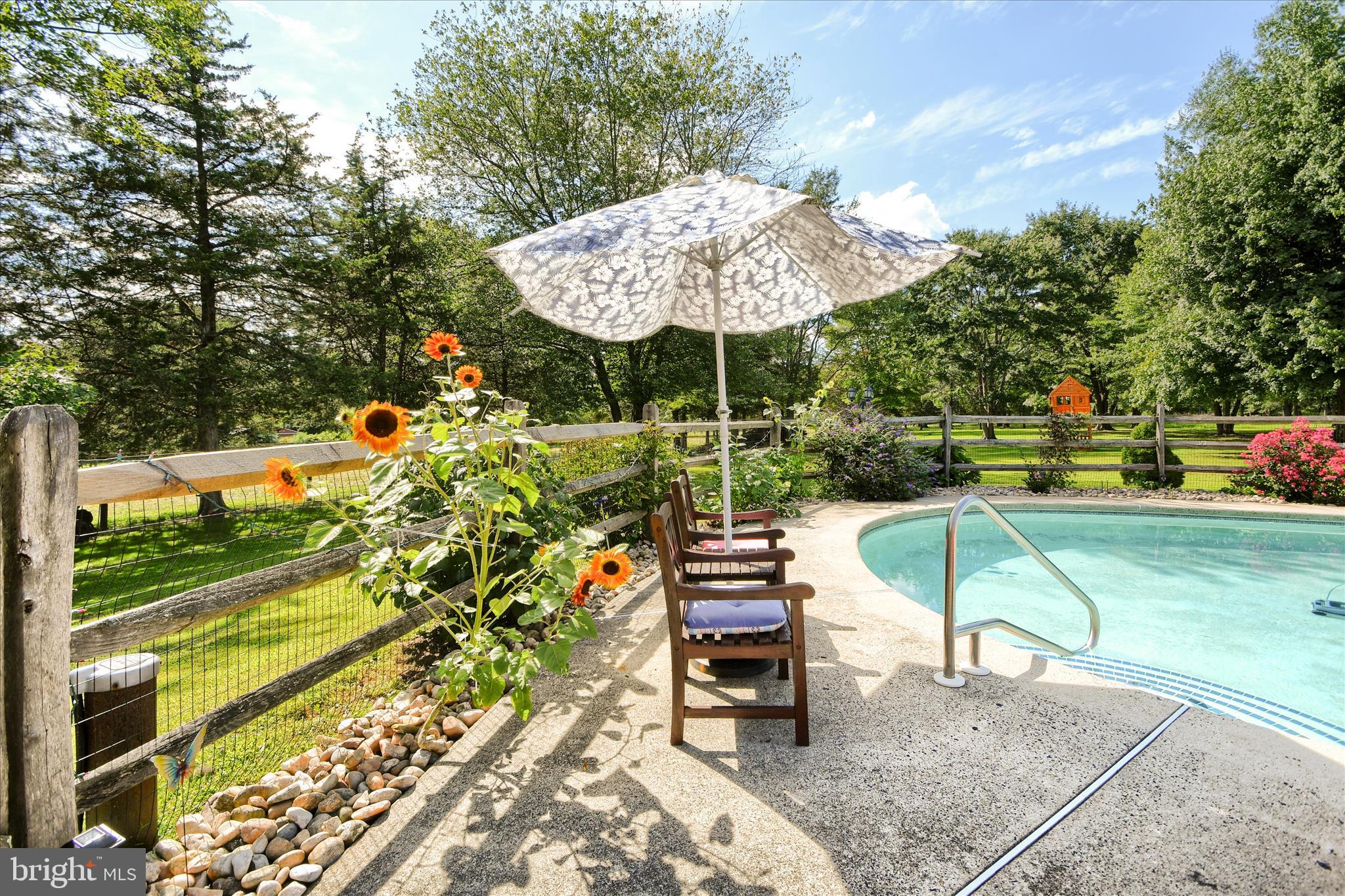 1010 Sweetbriar Road Perkasie, PA 18944 - Photo 46 of 59 an outdoor space with furniture and umbrella