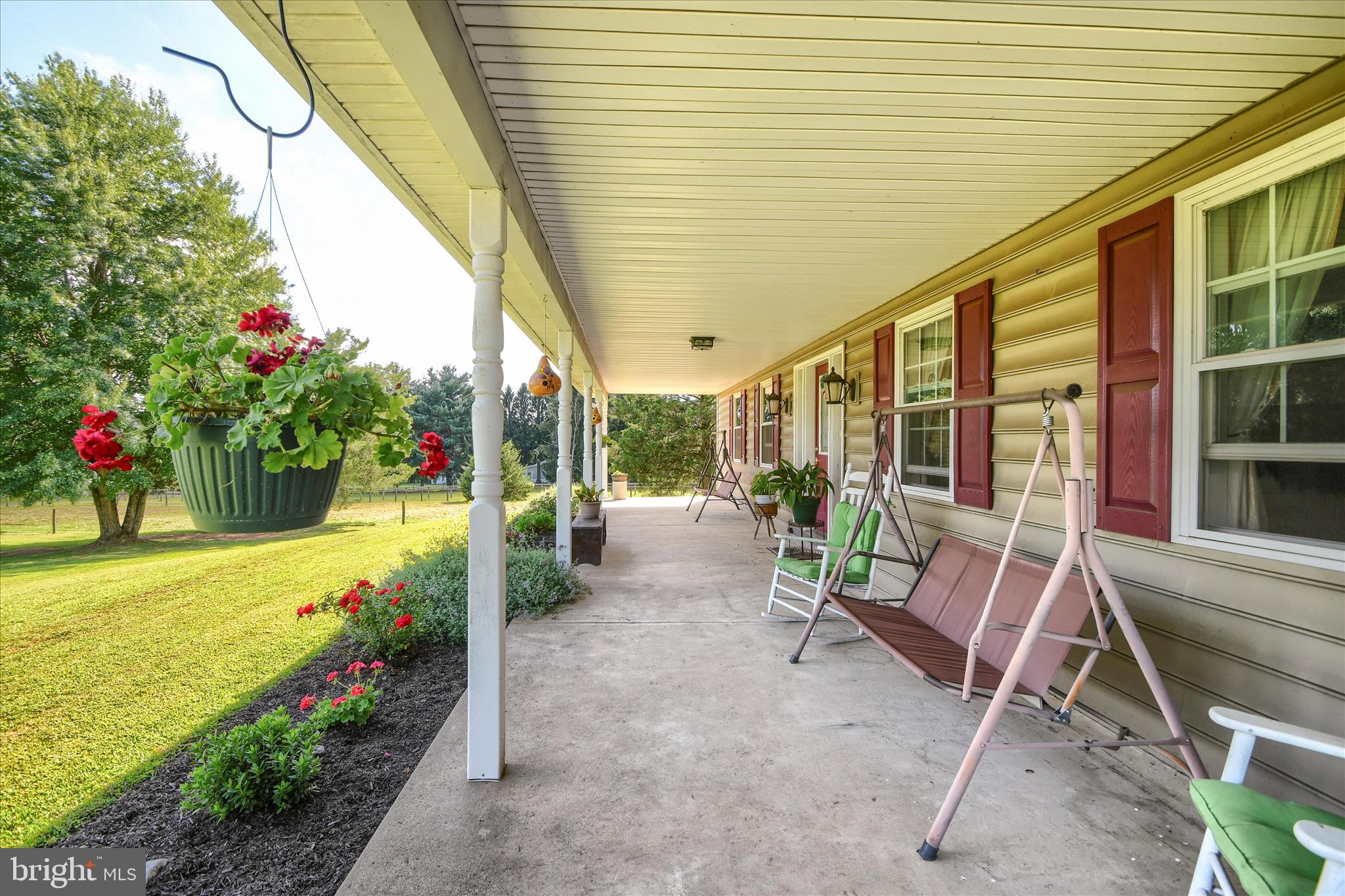 1010 Sweetbriar Road Perkasie, PA 18944 - Photo 8 of 59 a view of a patio with table and chairs and potted plants