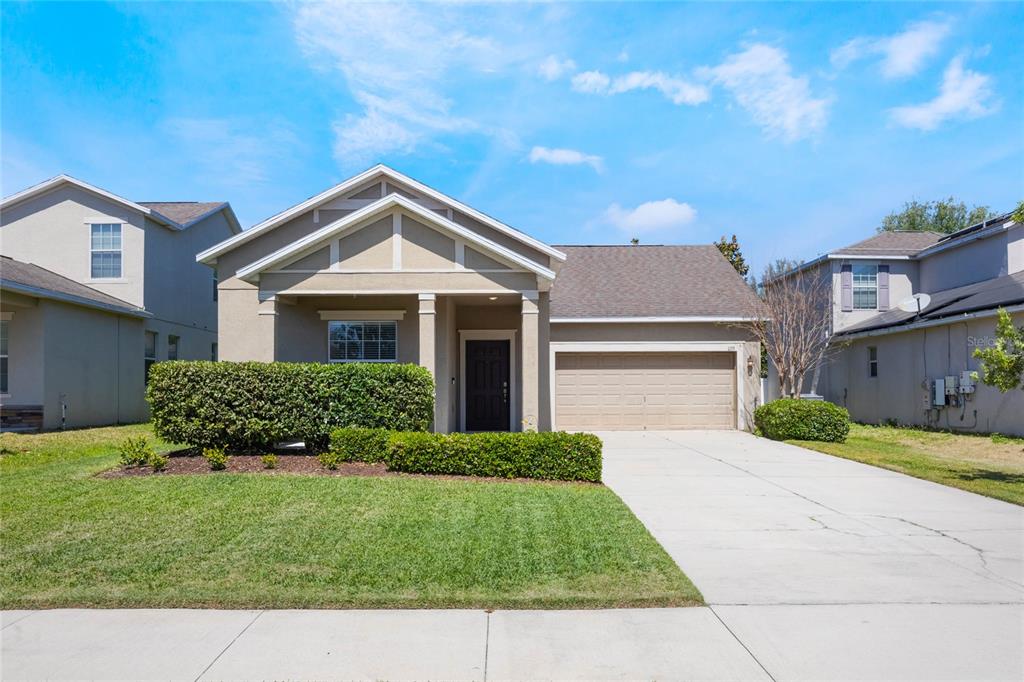 1155 Seburn Road Apopka, FL 32703 - Photo 1 of 1 a front view of a house with a yard