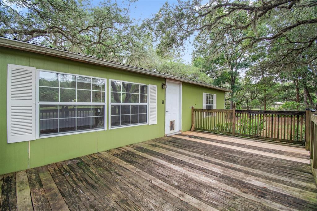 156 Kingfish Road Pomona Park, FL 32181 - Photo 7 of 55 a view of a house with a yard