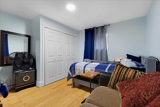 a bedroom with a bed and gym equipment