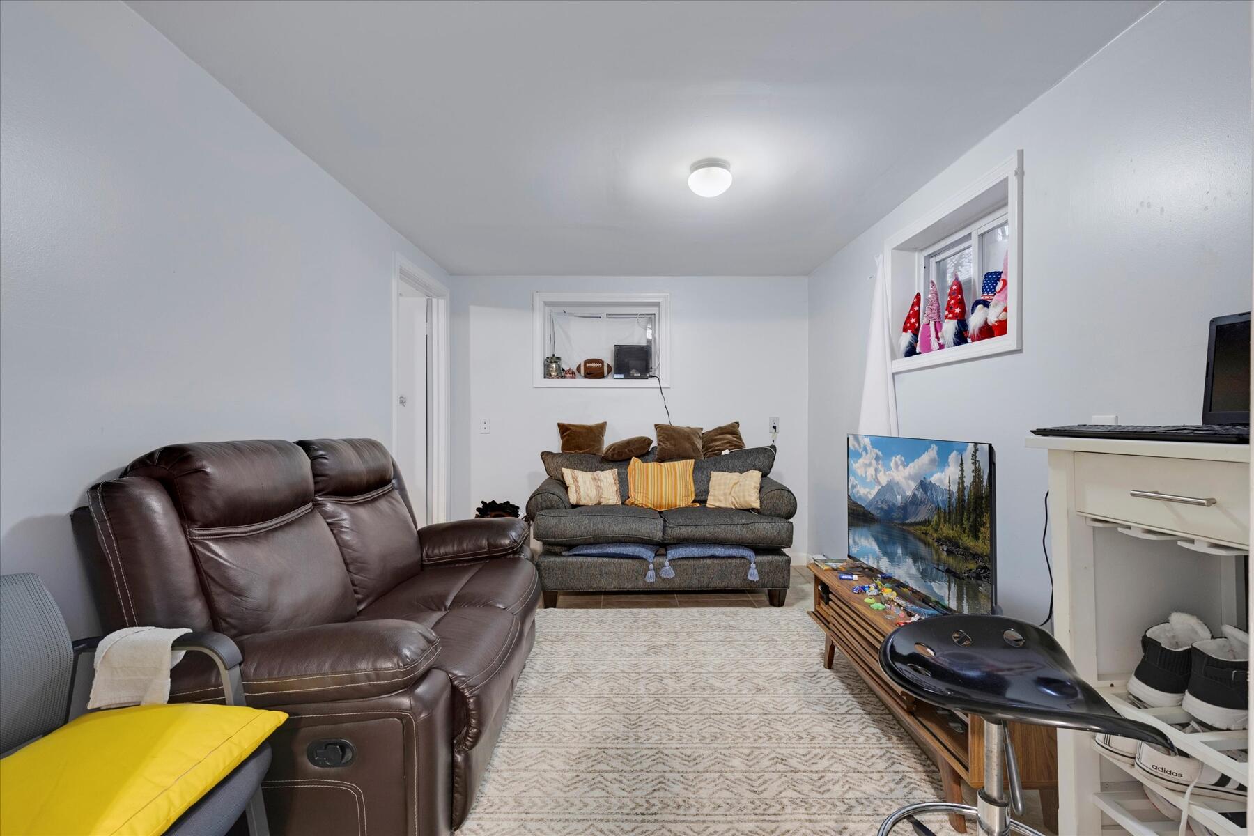 423 Lincoln Rd Extension Hyannis, MA 02601 - Photo 14 of 17 a living room with furniture and a flat screen tv