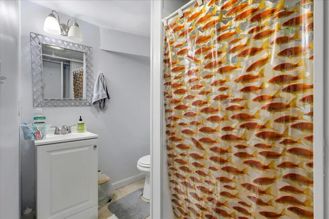 a bathroom with a toilet and a sink