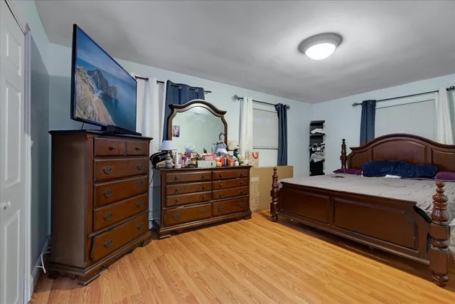 a bedroom with a bed and a dresser