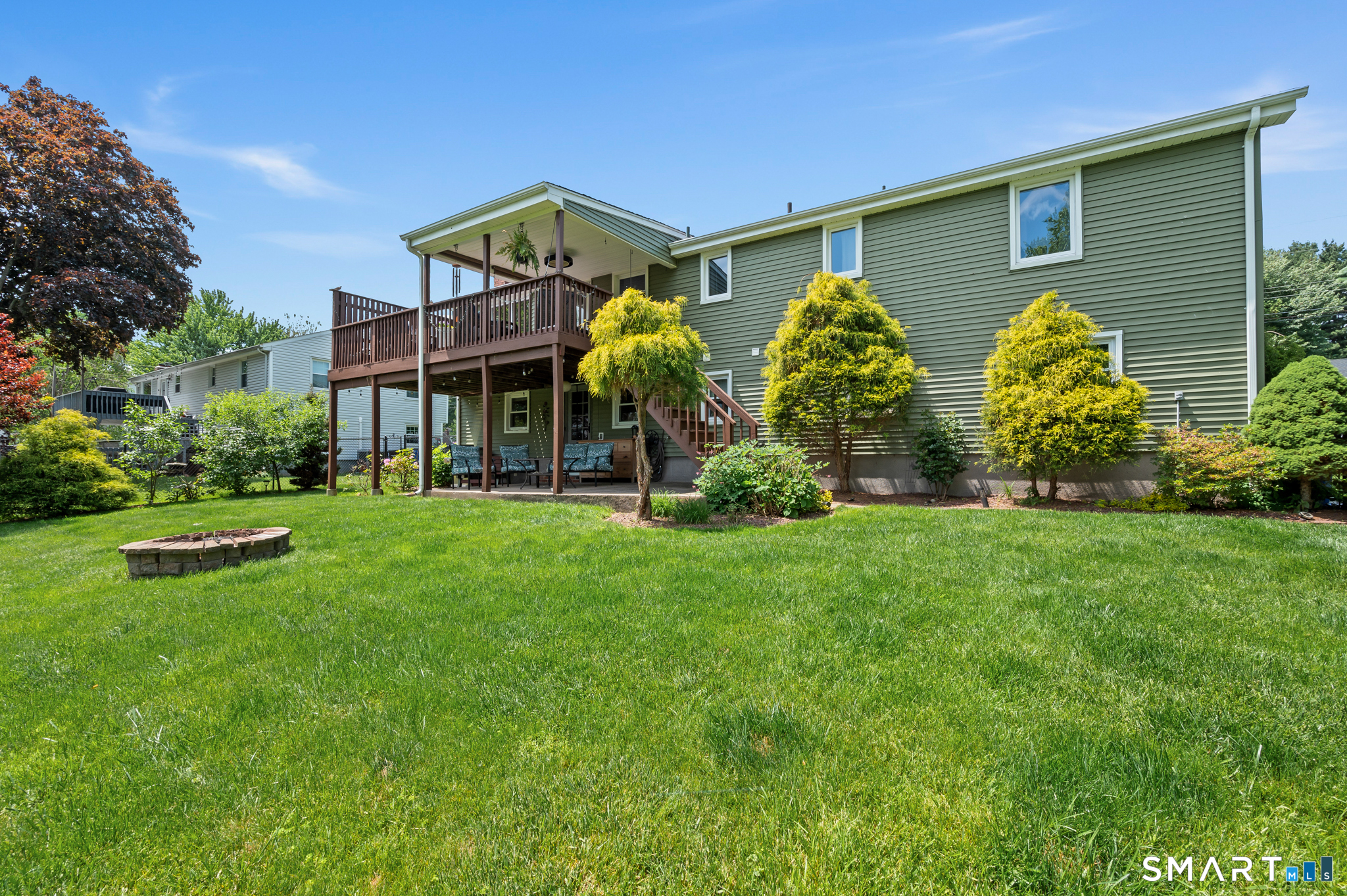 201 Ridge Crest Circle Wethersfield, CT 06109 - Photo 29 of 35 a view of a house with a big yard and potted plants