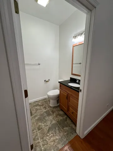 a bathroom with a toilet and a sink