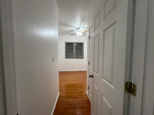 a view of a hallway with closet