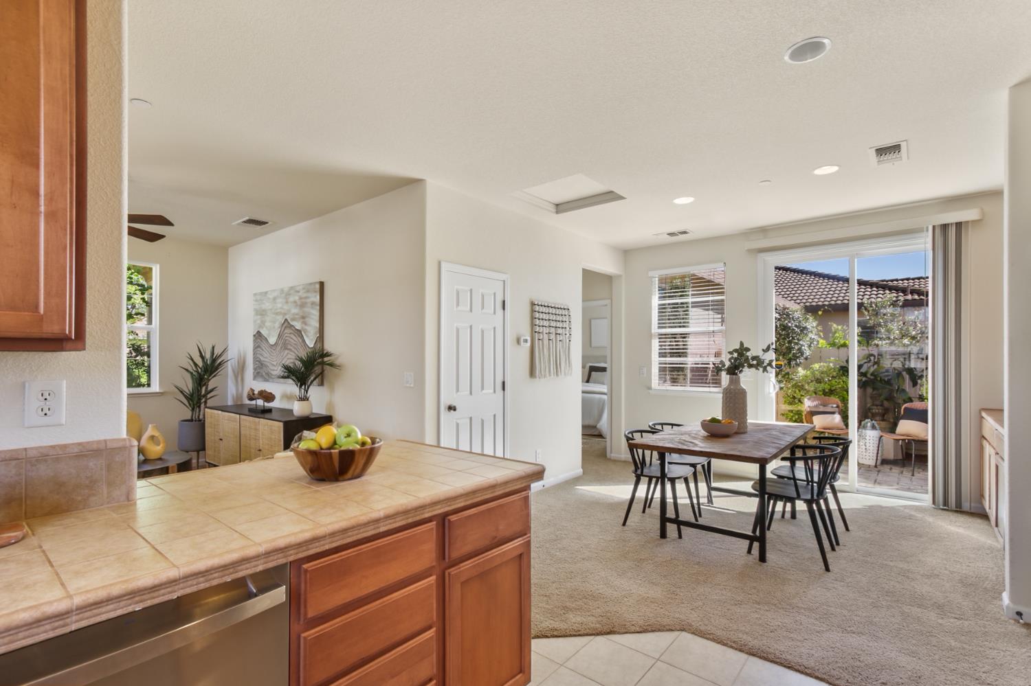 2128 Ragen Place Woodland, CA 95776 - Photo 18 of 40 a dining room with a table and chairs in it