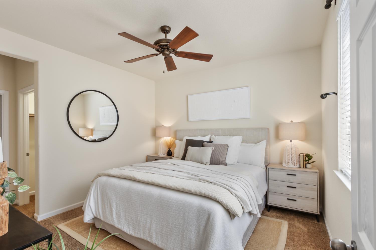 2128 Ragen Place Woodland, CA 95776 - Photo 20 of 40 a bedroom with a large bed and a chandelier