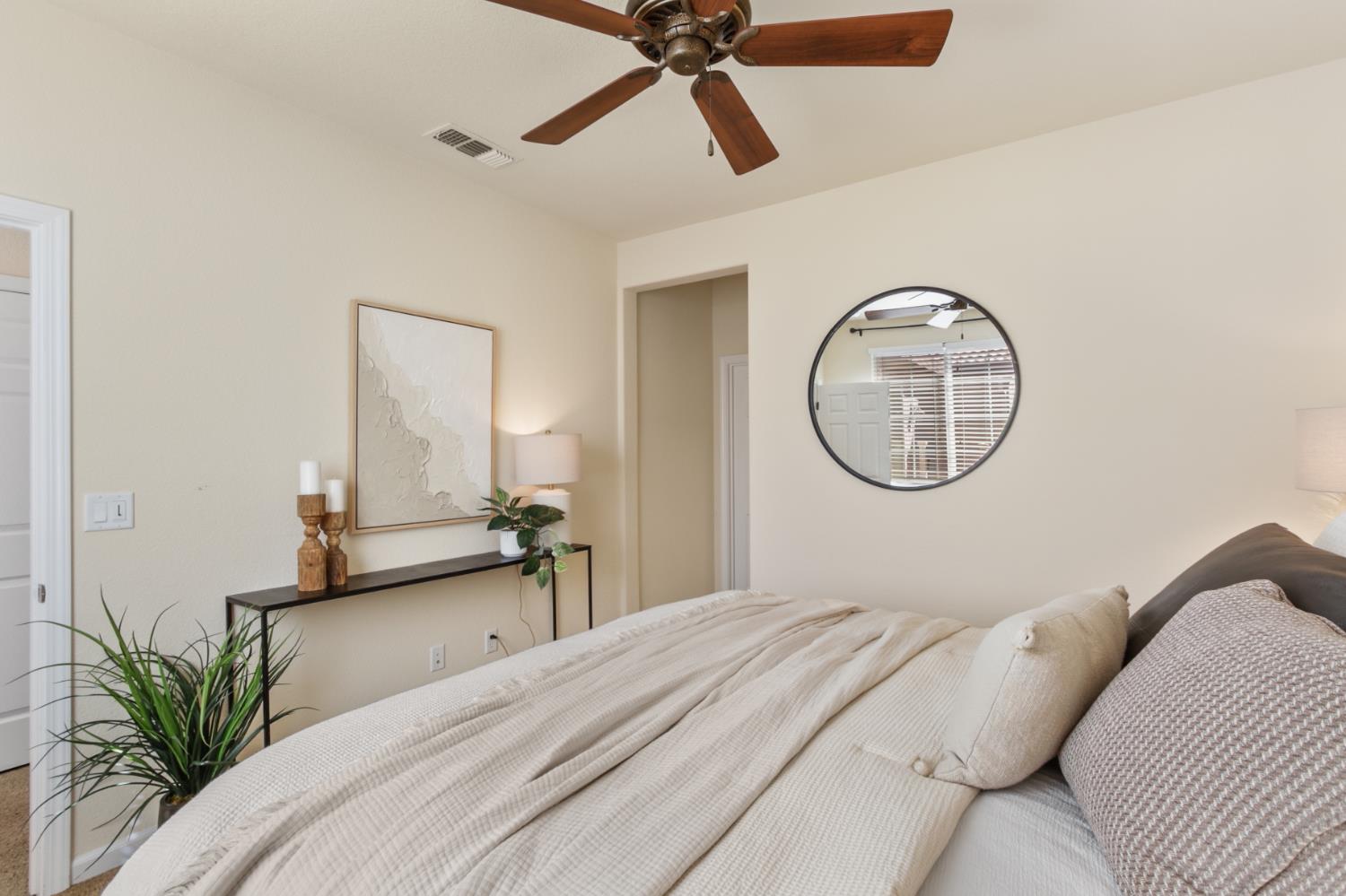 2128 Ragen Place Woodland, CA 95776 - Photo 21 of 40 a bedroom with bed and a chandelier