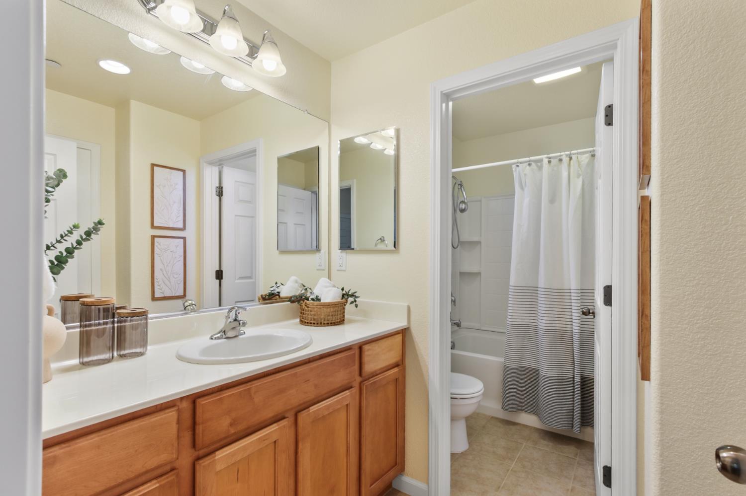 2128 Ragen Place Woodland, CA 95776 - Photo 22 of 40 a bathroom with a sink a toilet and shower