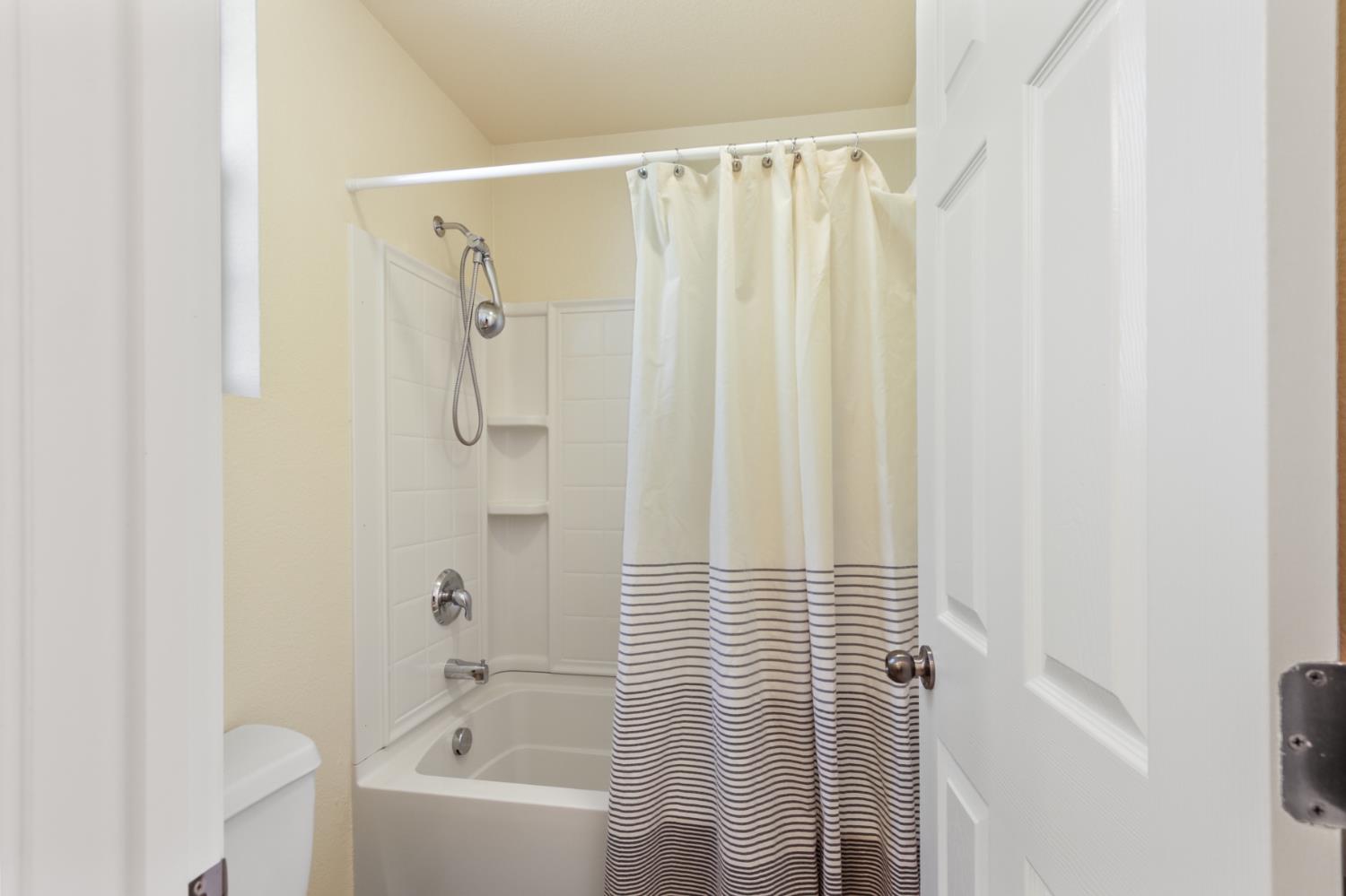 2128 Ragen Place Woodland, CA 95776 - Photo 24 of 40 a bathroom with a shower and a tub