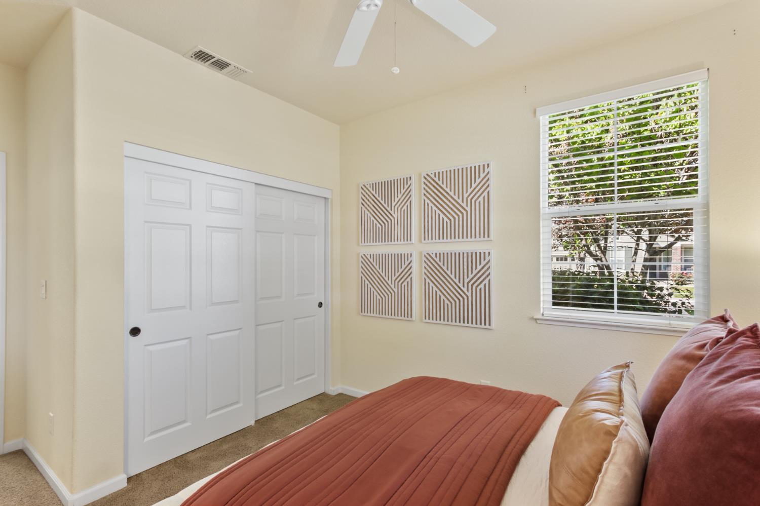 2128 Ragen Place Woodland, CA 95776 - Photo 28 of 40 a view of a bedroom with wooden floor and windows