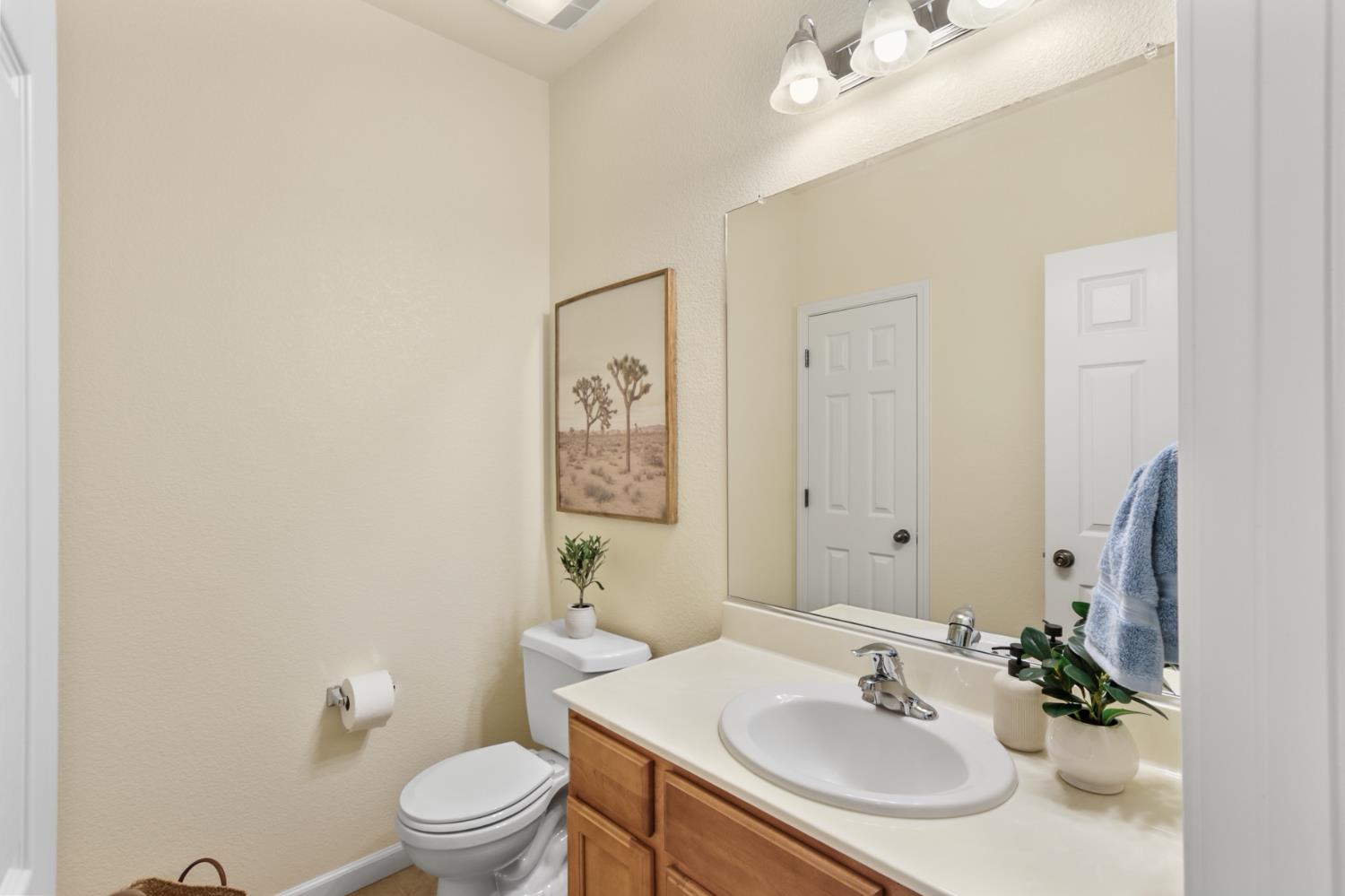 2128 Ragen Place Woodland, CA 95776 - Photo 29 of 40 a bathroom with a sink toilet and a mirror