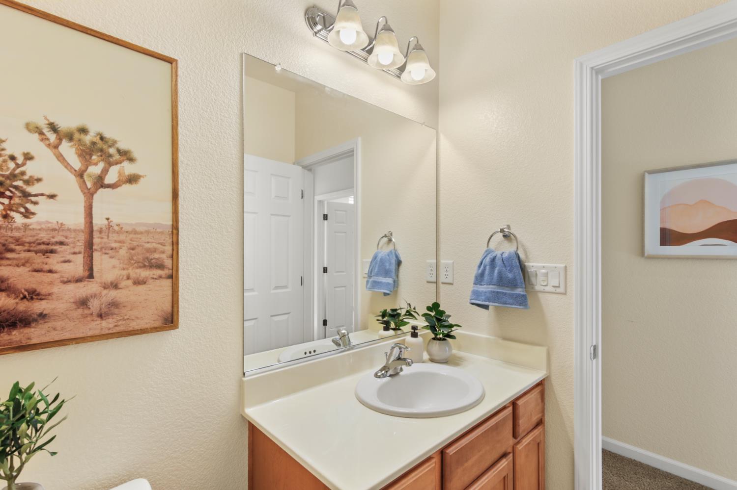 2128 Ragen Place Woodland, CA 95776 - Photo 30 of 40 a bathroom with a sink vanity and a mirror