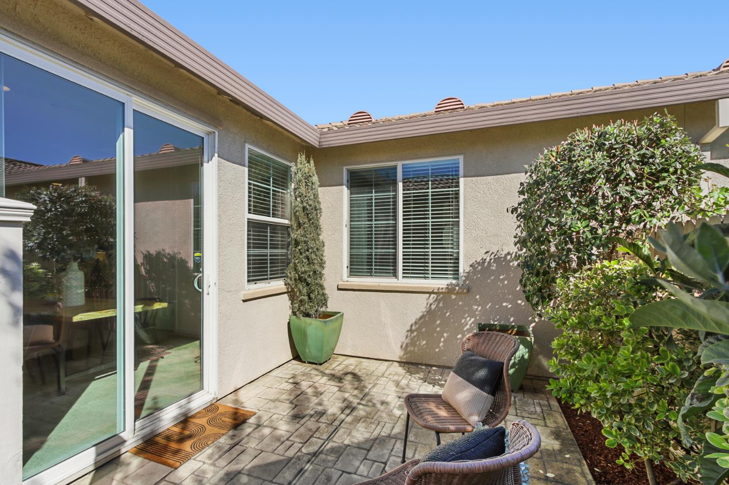 2128 Ragen Place Woodland, CA 95776 - Photo 35 of 40 a front view of a house with outdoor seating and plants