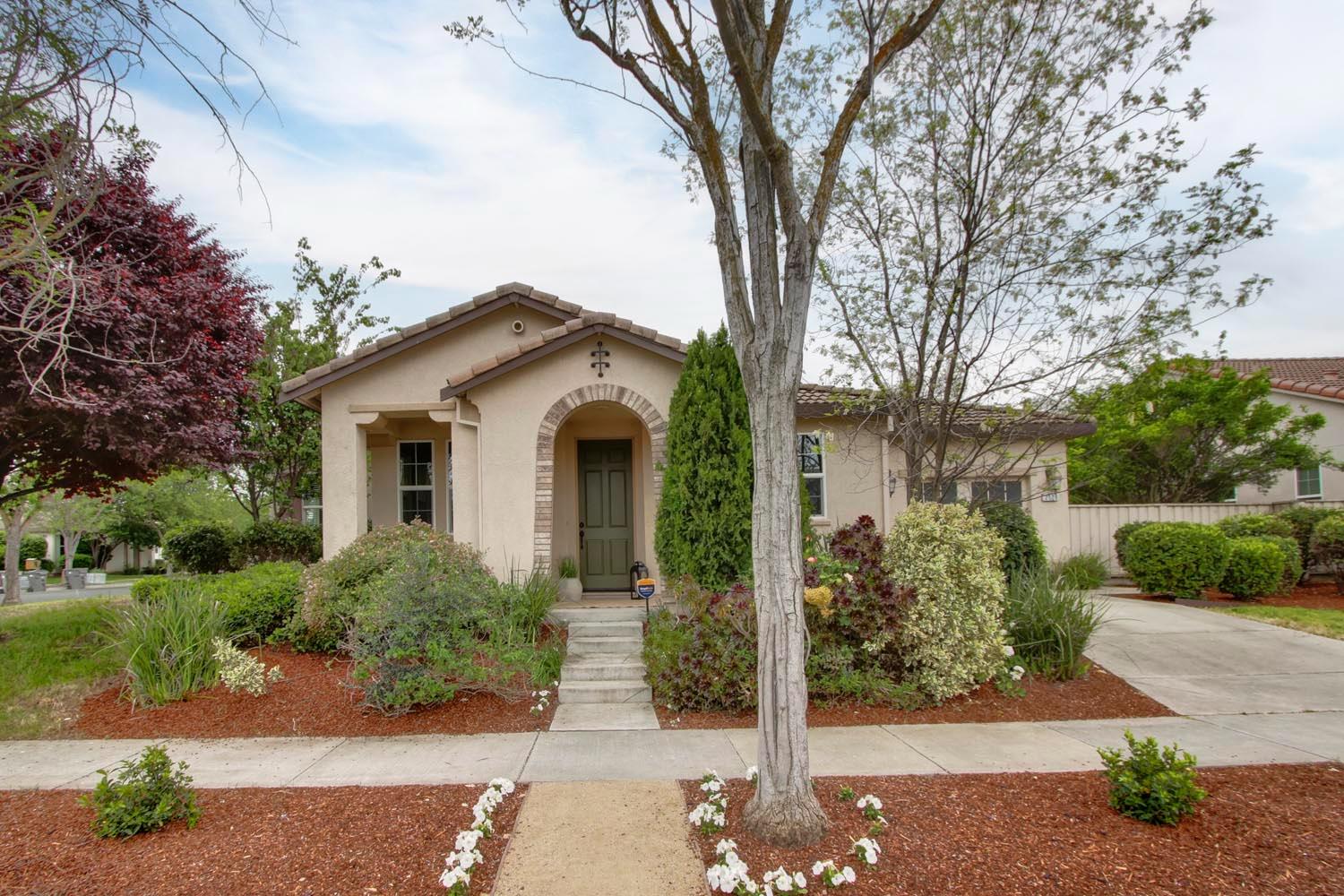2128 Ragen Place Woodland, CA 95776 - Photo 39 of 40 a view of a white house with a yard and plants