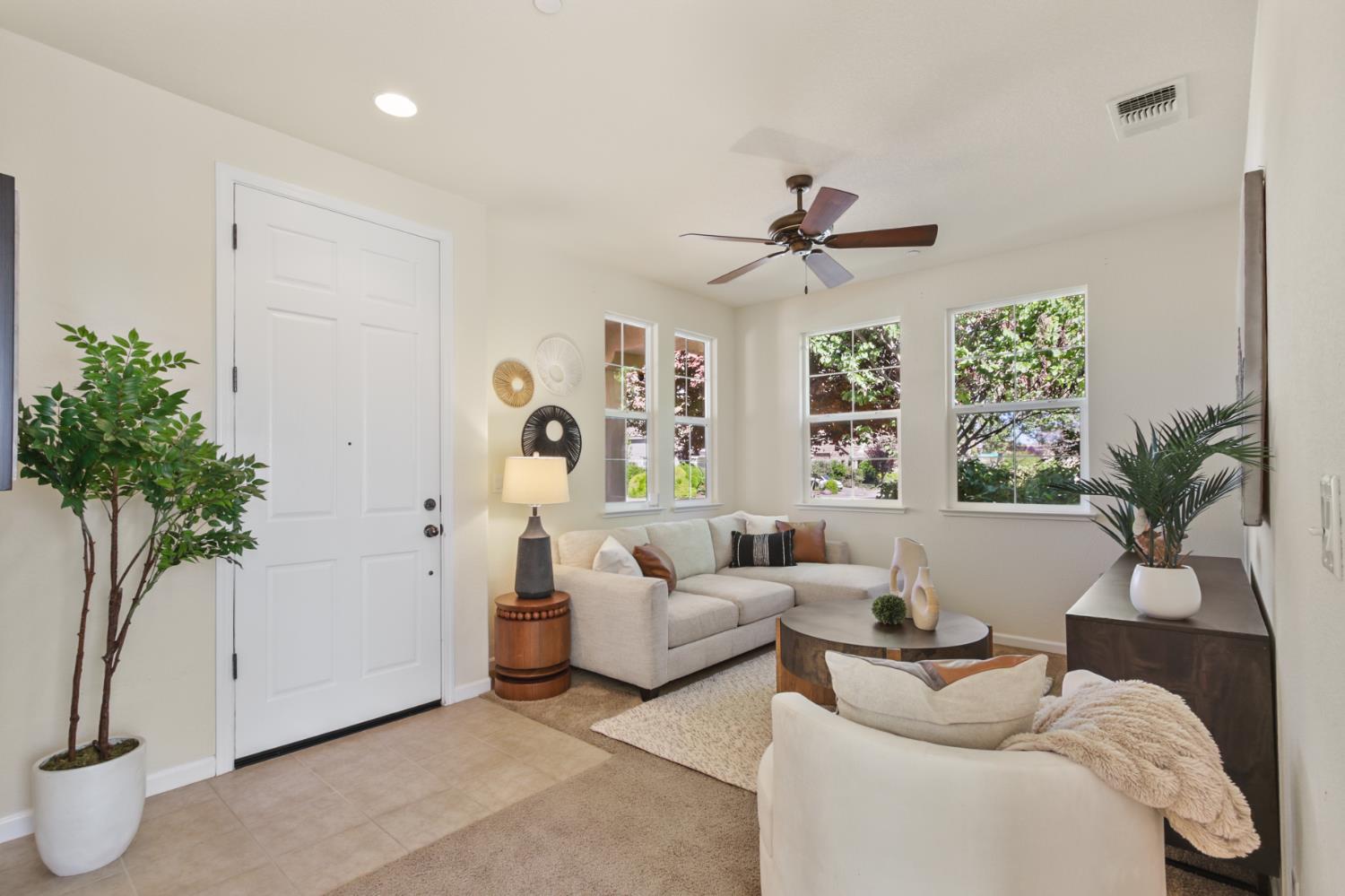 2128 Ragen Place Woodland, CA 95776 - Photo 5 of 40 a living room with furniture and a potted plant