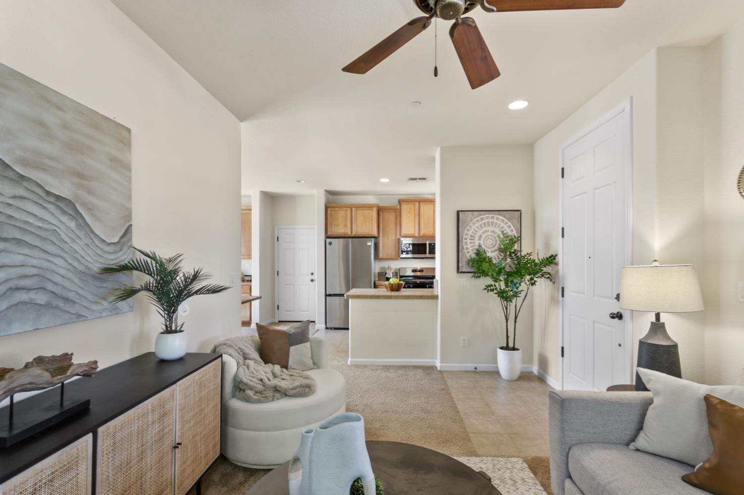 2128 Ragen Place Woodland, CA 95776 - Photo 7 of 40 a living room with furniture and a potted plant