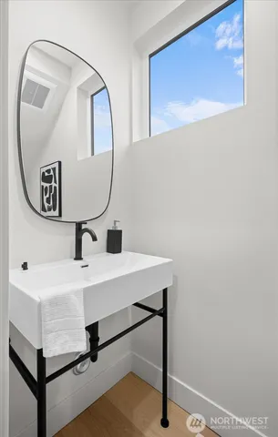 a bathroom with a sink and a mirror