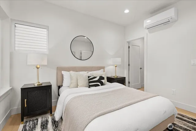 a bedroom with a bed and a window