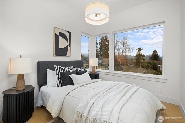 a bedroom with a large bed and a window