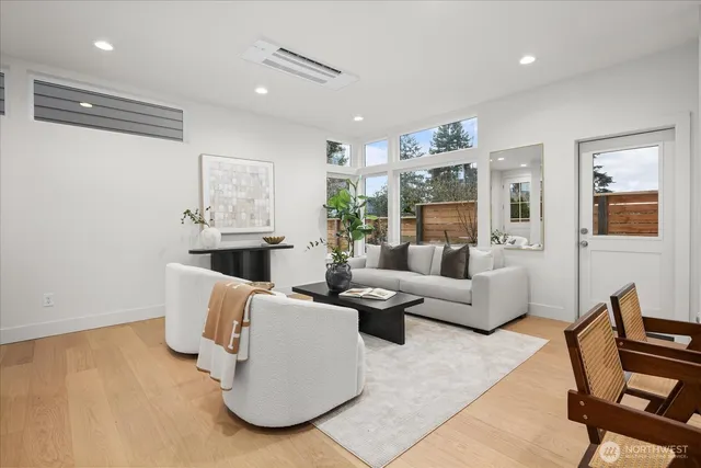 a living room with furniture and a large window