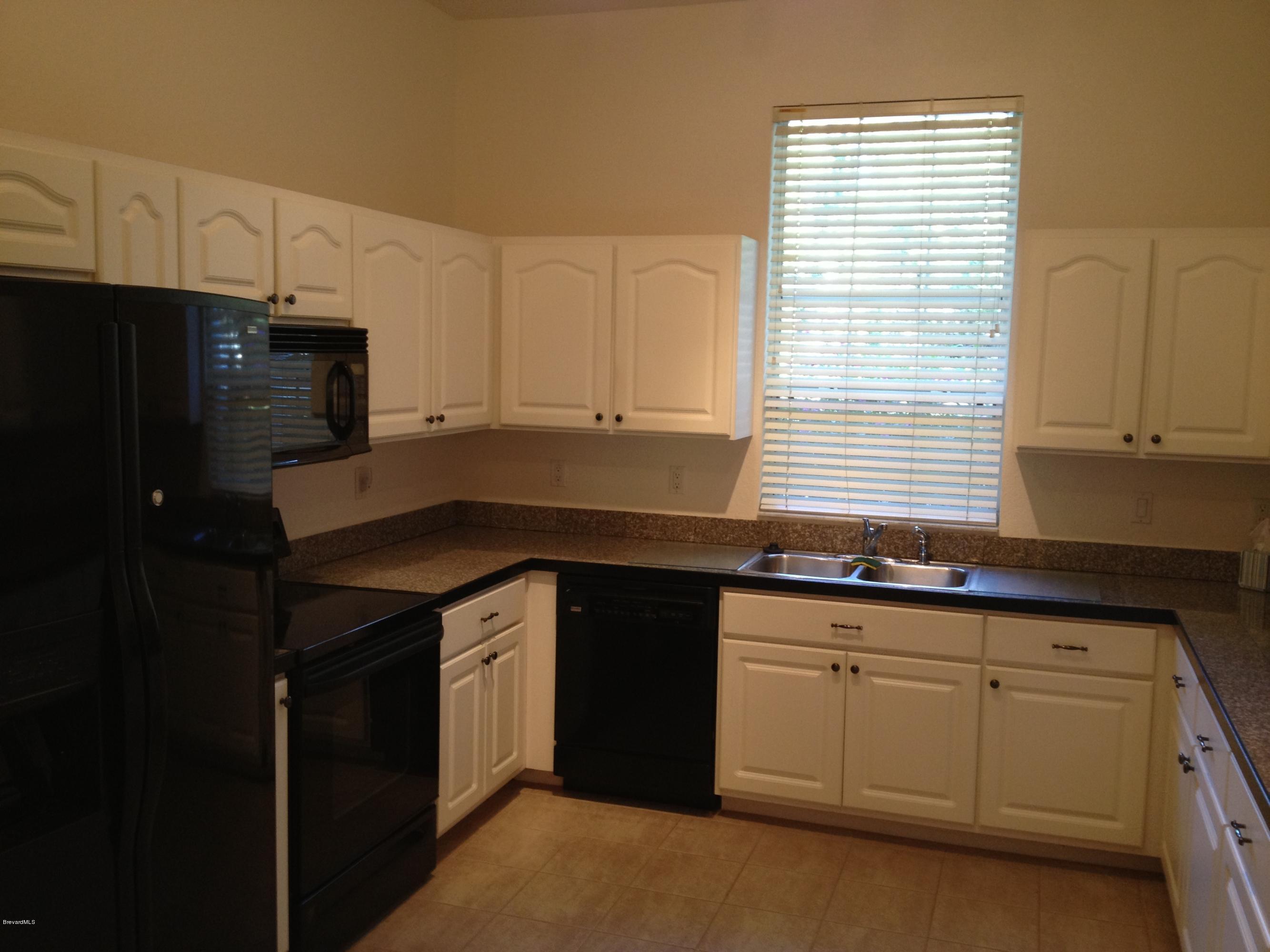 1130 Meadowbrook Road Northeast Palm Bay, FL 32905 - Photo 3 of 13 Kitchen
