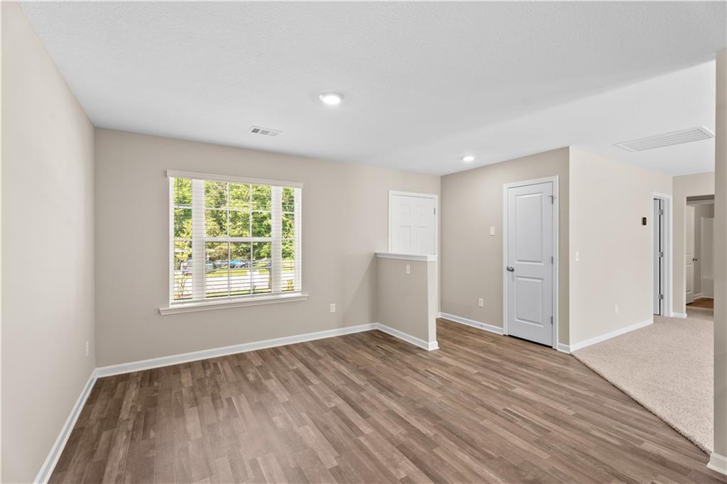 31 Whiterock Road Phenix City, AL 36869 - Photo 9 of 36 Empty room with light wood-style floors and recessed lighting