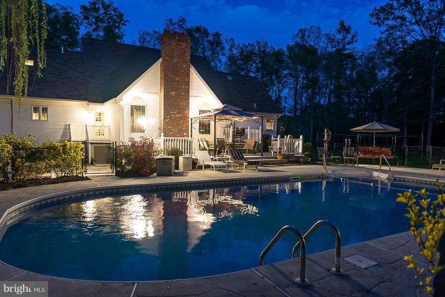 6325 Hawkins Gate Road La Plata, MD 20646 - Photo 30 of 30 In-ground pool with patio and deck area