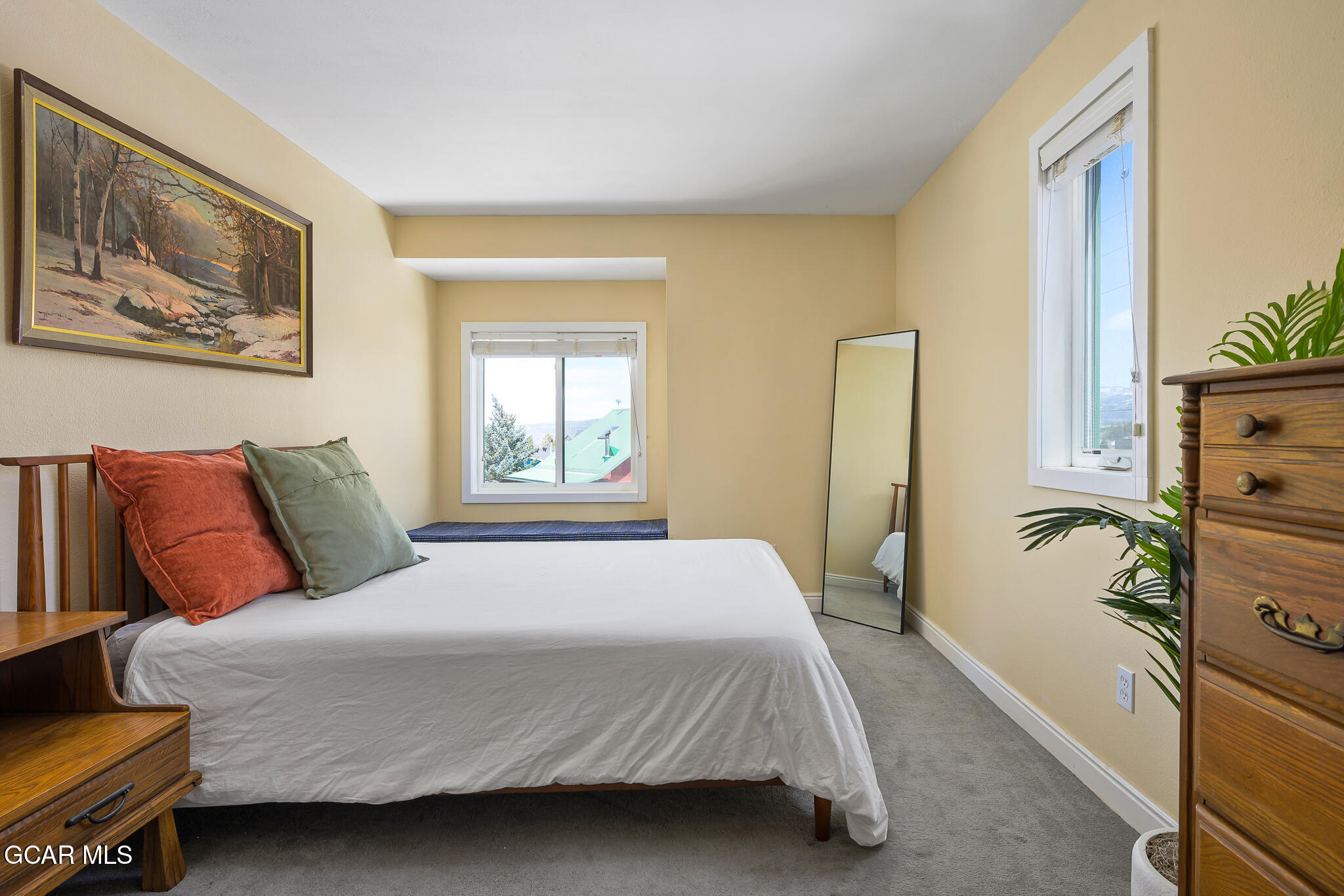 110 Carriage Road, Unit 8 Fraser, CO 80442 - Photo 19 of 36 a bedroom with a large bed and a window