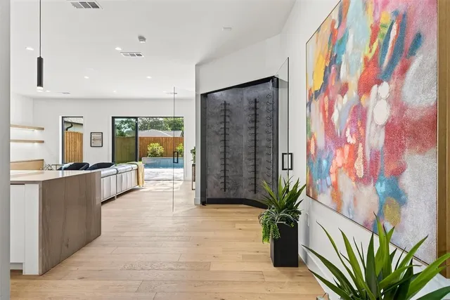 a view of entryway with wooden floor and a potted plant