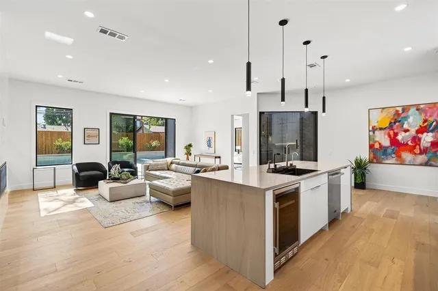 a kitchen with stainless steel appliances a stove and a microwave