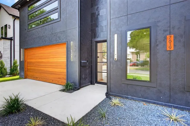 a large kitchen with stainless steel appliances kitchen island granite countertop a stove and a view of living room