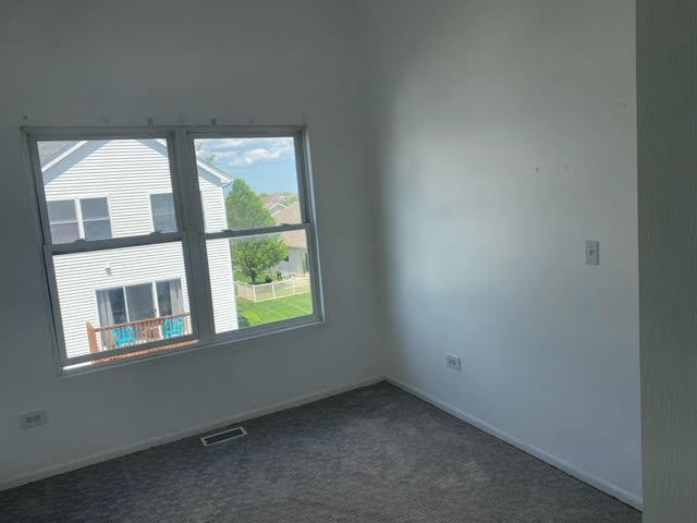 1365 Fox Hound Trail Beecher, IL 60401 - Photo 16 of 22 a view of an empty room with a window