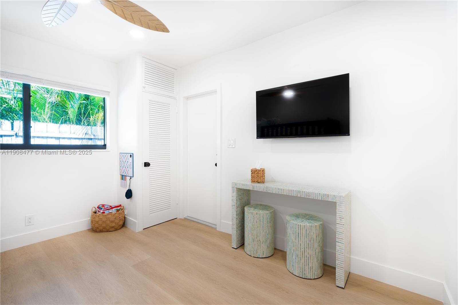 309 South Riverside Drive Pompano Beach, FL 33062 - Photo 17 of 23 a living room with furniture and a flat screen tv