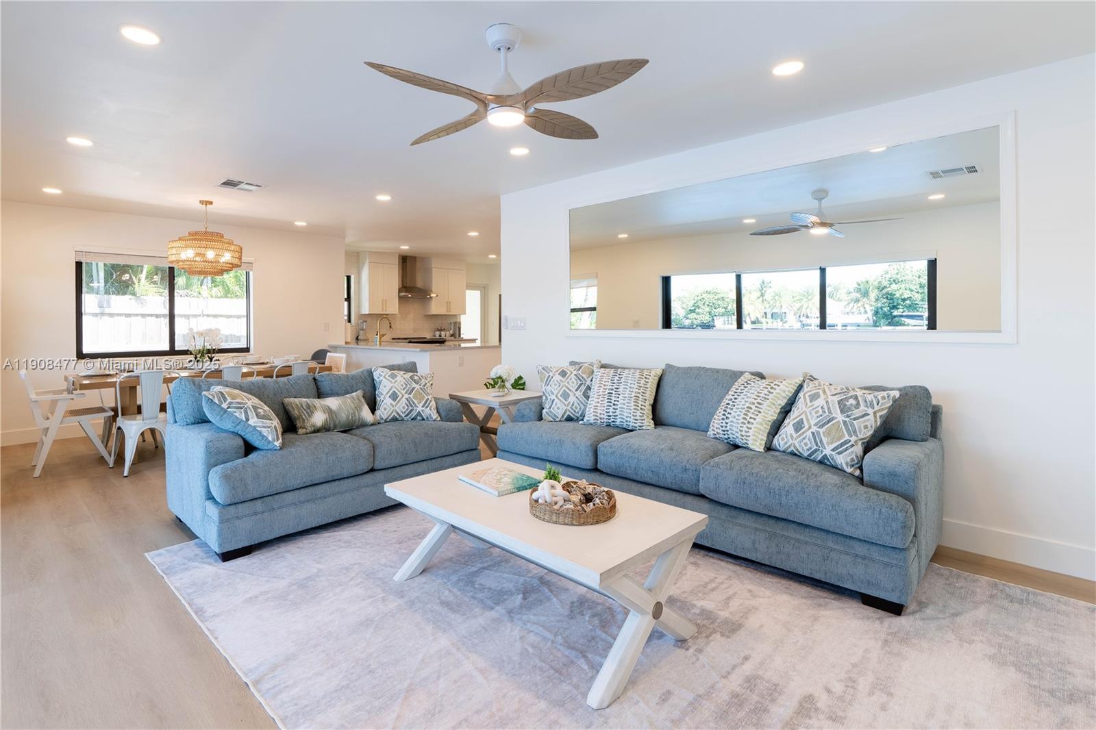309 South Riverside Drive Pompano Beach, FL 33062 - Photo 6 of 23 a living room with furniture and a large window