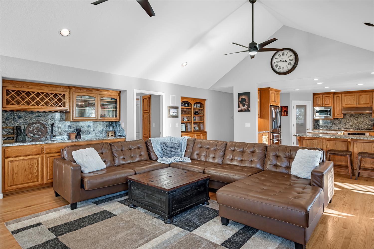 5772 Dragon Springs Road Placerville, CA 95667 - Photo 22 of 85 a living room with furniture a clock and a view of kitchen