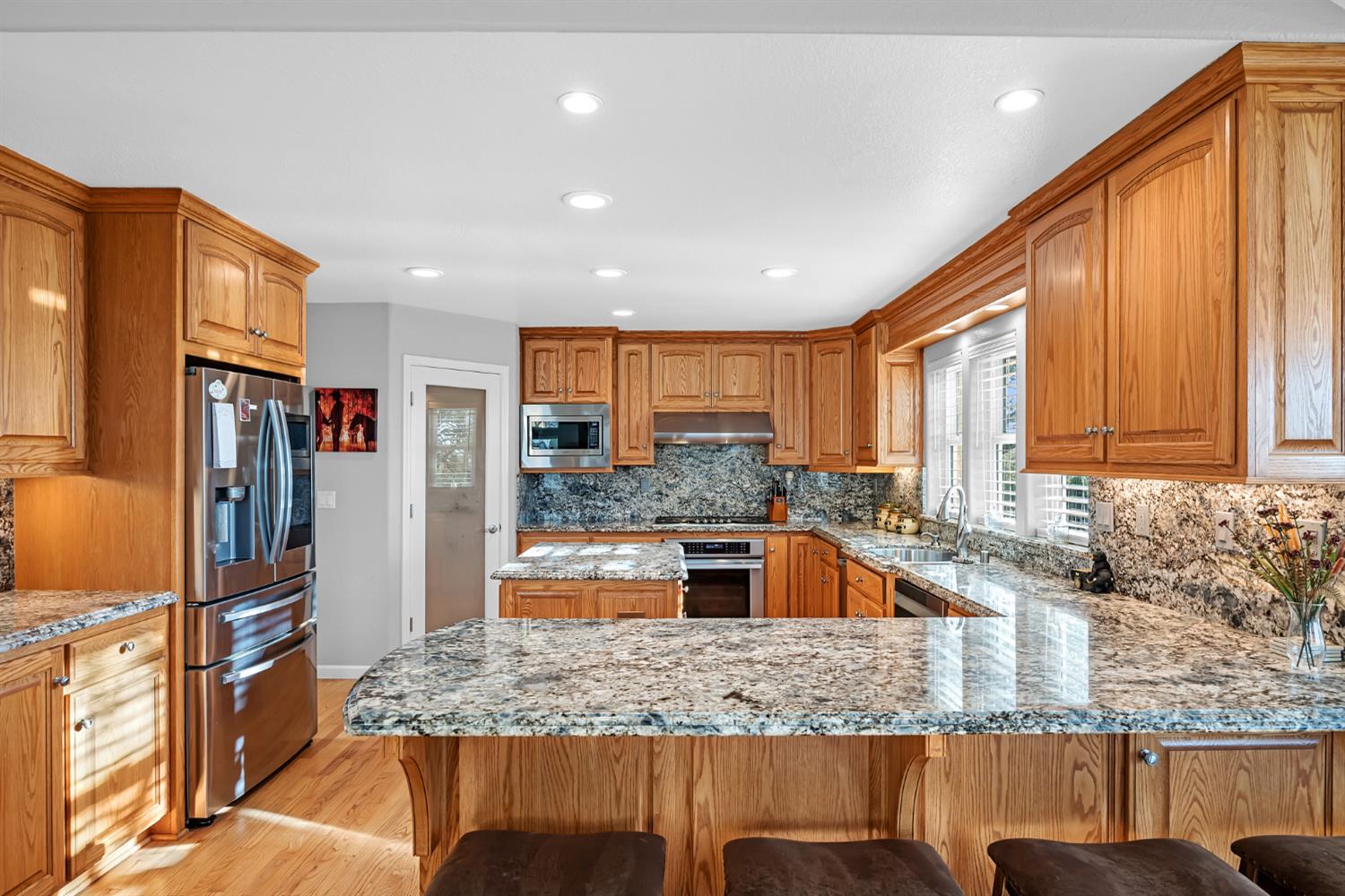 5772 Dragon Springs Road Placerville, CA 95667 - Photo 24 of 85 a kitchen with stainless steel appliances granite countertop a sink and a refrigerator