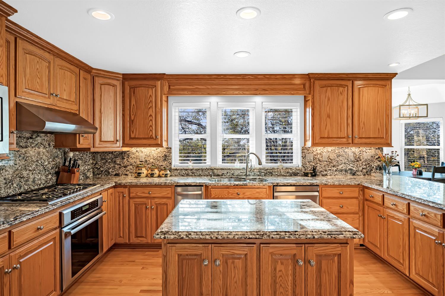5772 Dragon Springs Road Placerville, CA 95667 - Photo 27 of 85 a kitchen with stainless steel appliances granite countertop a sink stove and cabinets