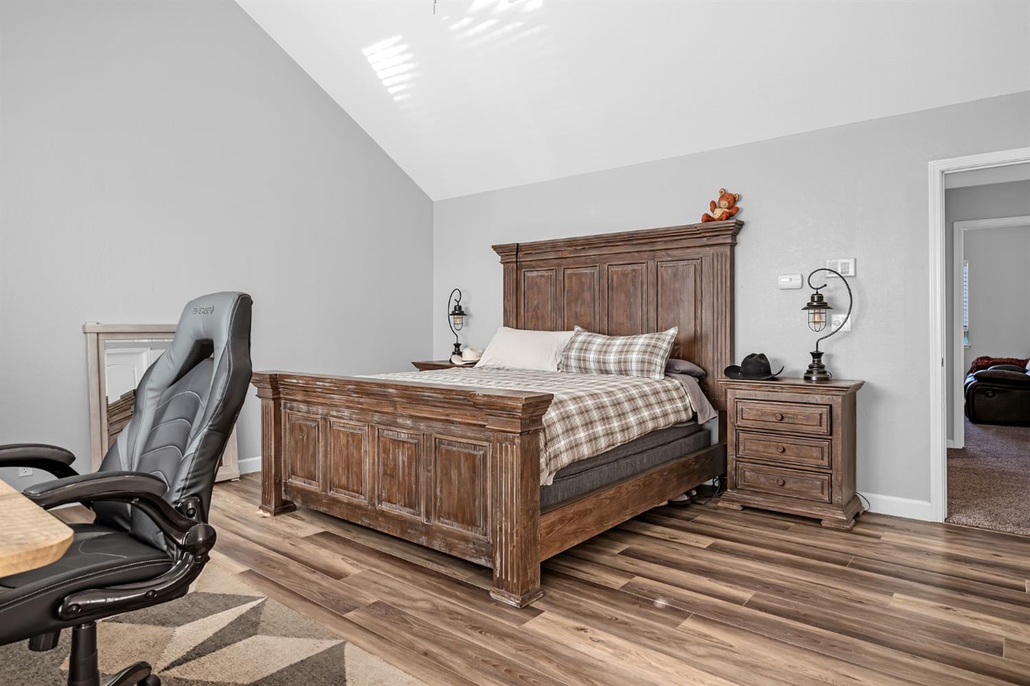 5772 Dragon Springs Road Placerville, CA 95667 - Photo 36 of 85 a bedroom with a bed and a flat tv screen on the dresser