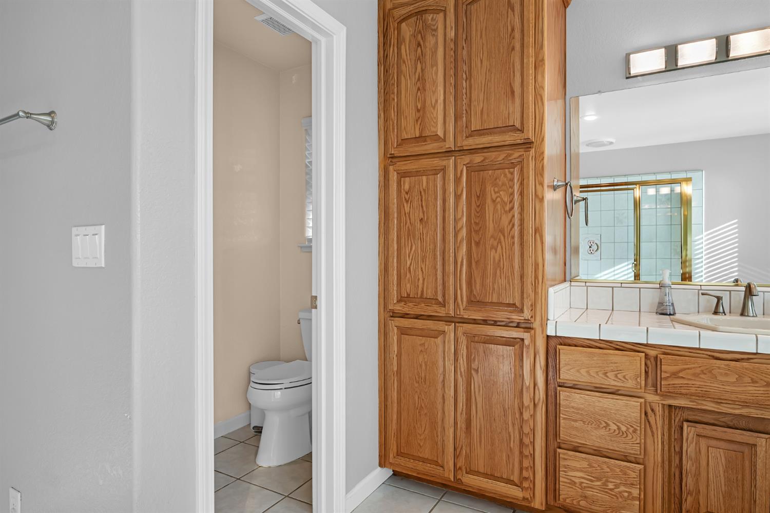 5772 Dragon Springs Road Placerville, CA 95667 - Photo 39 of 85 a bathroom with a granite countertop sink toilet and shower
