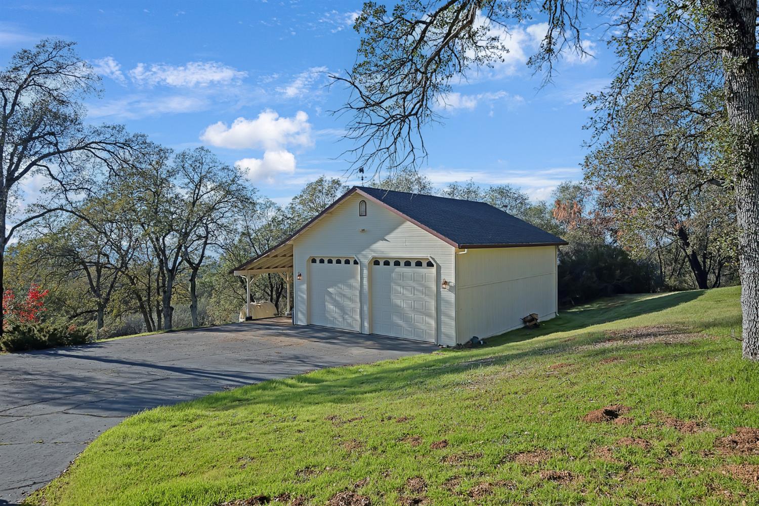 5772 Dragon Springs Road Placerville, CA 95667 - Photo 5 of 85 a view of a house with a yard and large tree