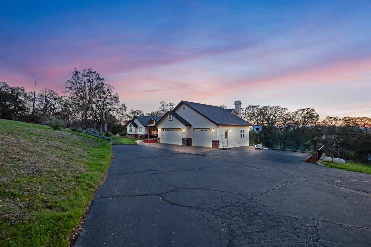 5772 Dragon Springs Road Placerville, CA 95667 - Photo 6 of 85 a front view of a house with a yard and garage
